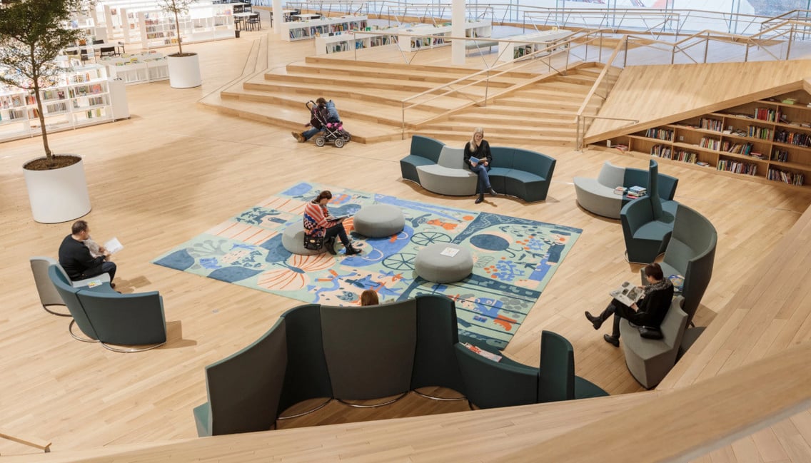 handgefertigte auftragsteppiche mit wunschmotiven für bibliotheksprojekt