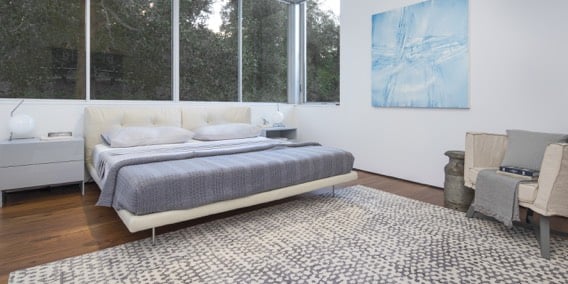 large beige rug with abstract grey pattern for modern bedrooms