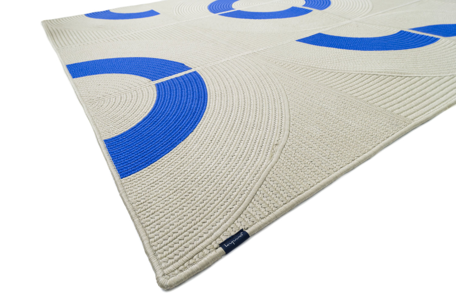 white and blue outdoor rug with customisable braided circle design open loop