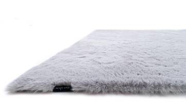 Grey, voluminous faux fur rug