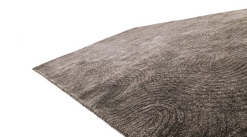 brown sustainable outdoor rug with abstract wave design made from recycled PET and awarded with the German Design Award