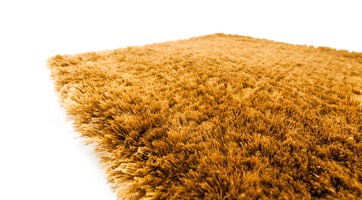 fluffy yellow rug handmade from polyester