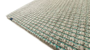 handwoven wool rug in natural colours and scandinavian style
