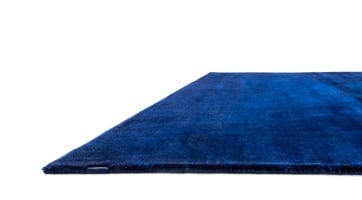 handwoven rug in intense blue made from soft yet resilient polyester