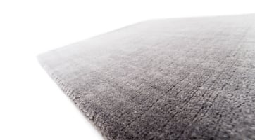 thick grey rug without pattern handwoven from New Zealand wool strongly sound absorbing