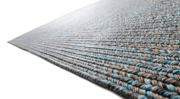 braided green rug suitable for outdoor use made from durable polypropylene