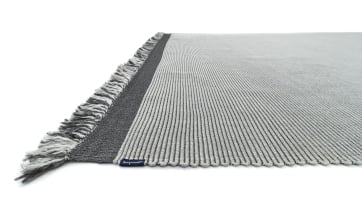 light and flat outdoor rug with fringes