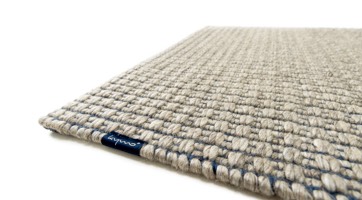 handwoven wool rug in natural colours and scandinavian style