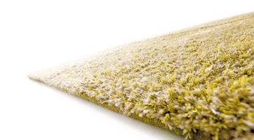 flauschiger gelber Teppich handgewebt aus Wolle und Polyesterfäden mit dichtem Flor